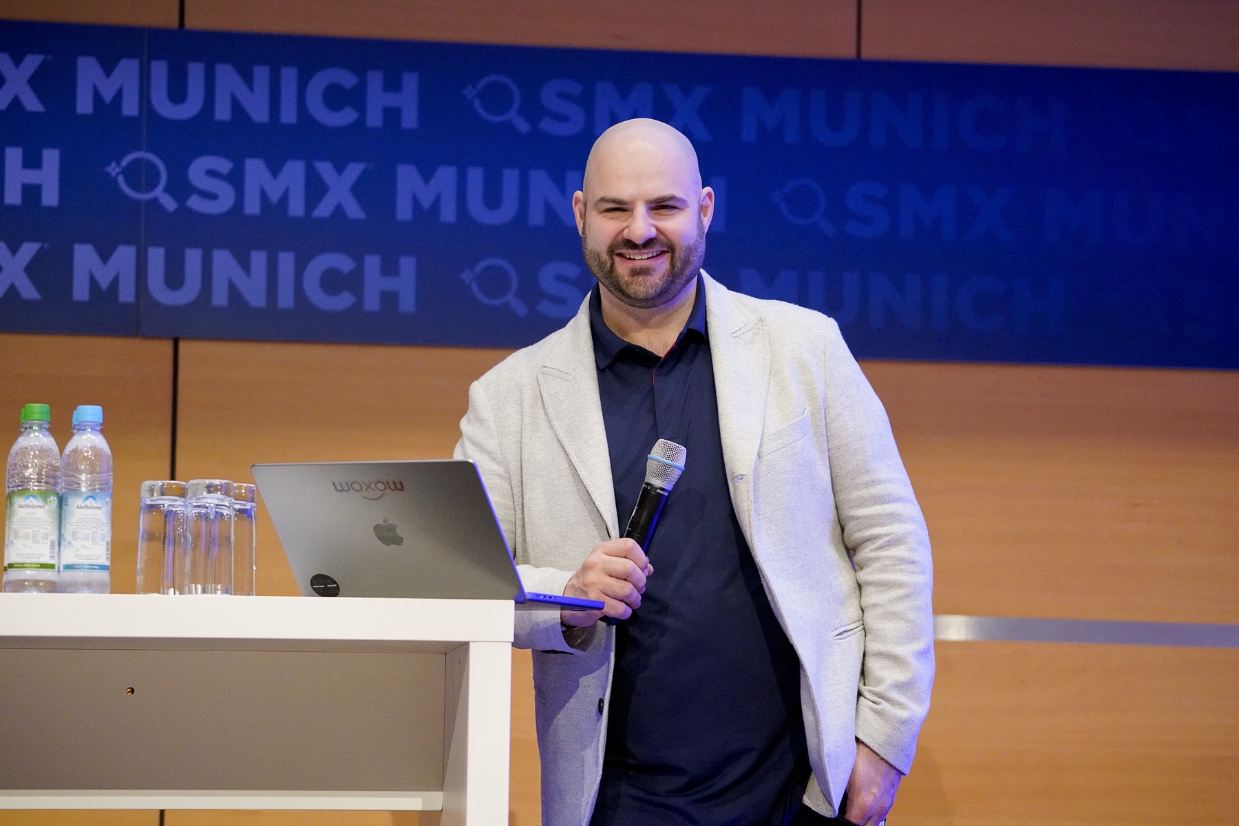 Timon Hartung speaking on stage at SMX Munich