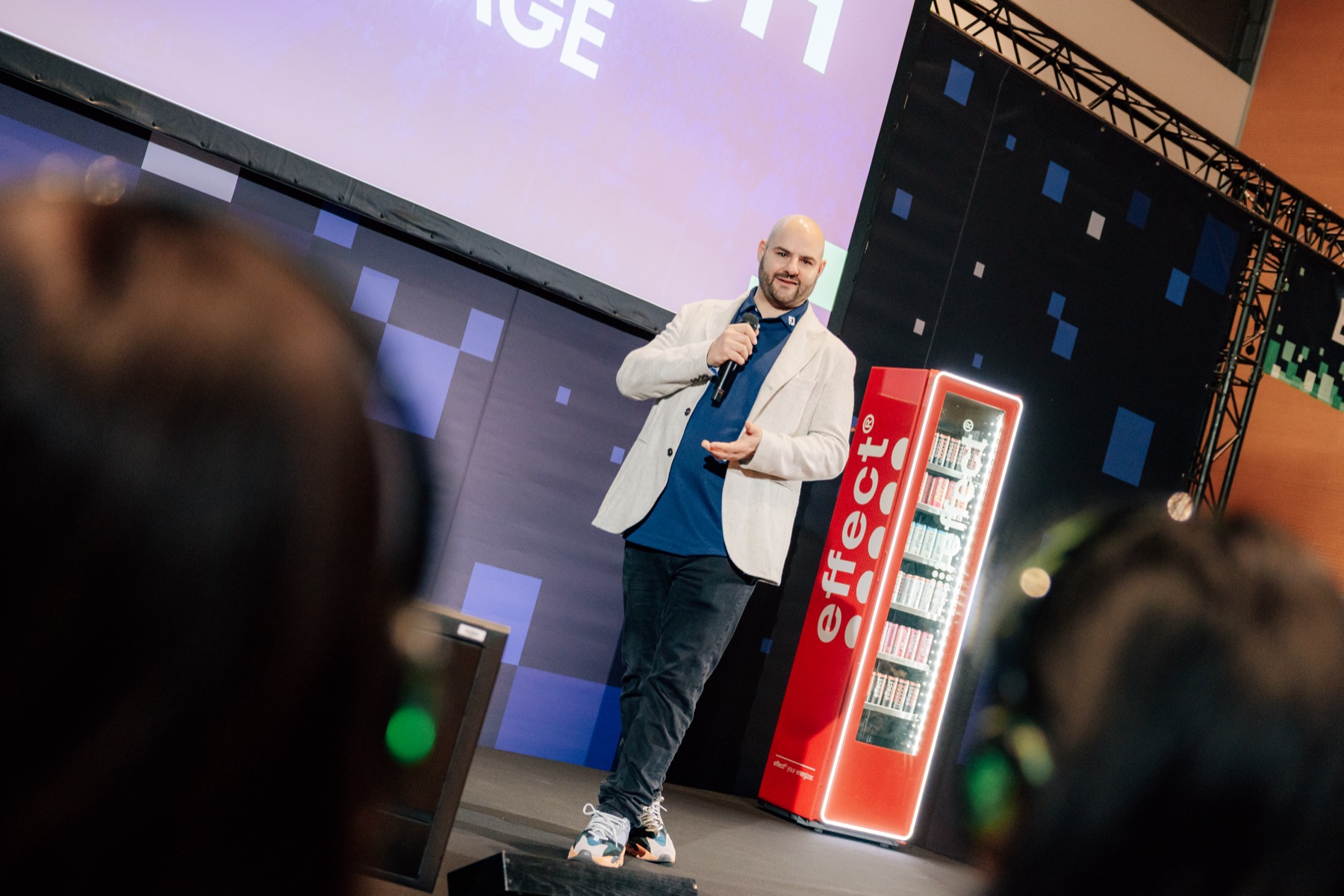 Timon Hartung speaking at a conference
